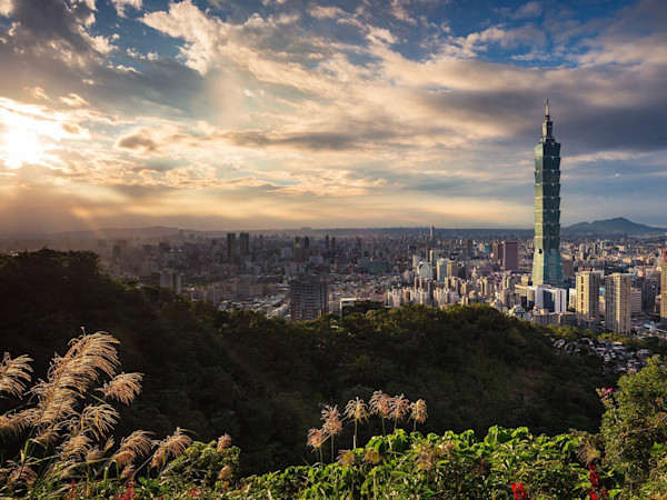 Taiwan Visual of Taiwan Building at sunset with mountain peaks in the distance!