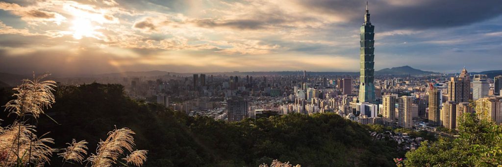 Taiwan Building Visual of Taiwan Building at sunset with mountain peaks in the distance!